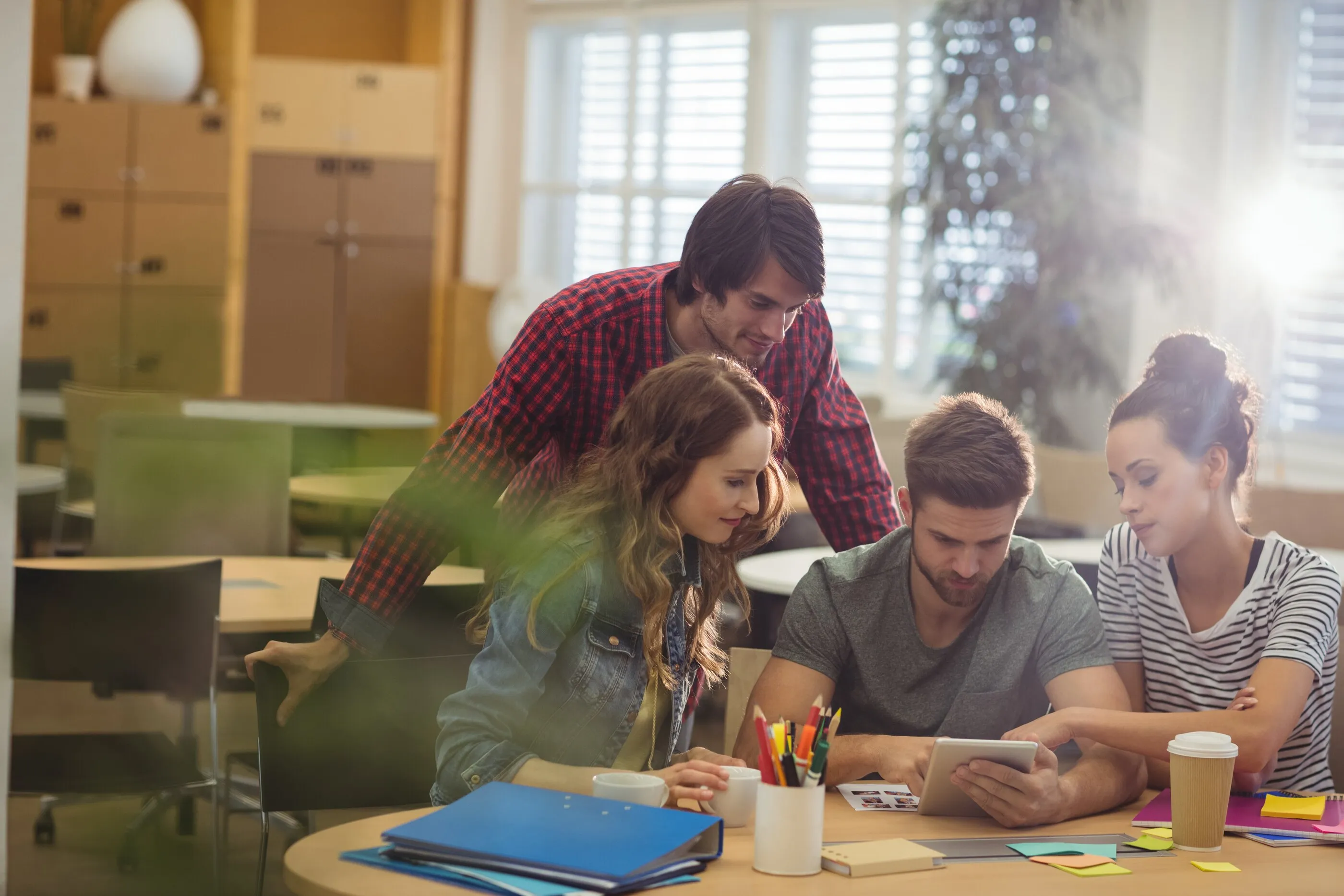 A team going over their operation in an office