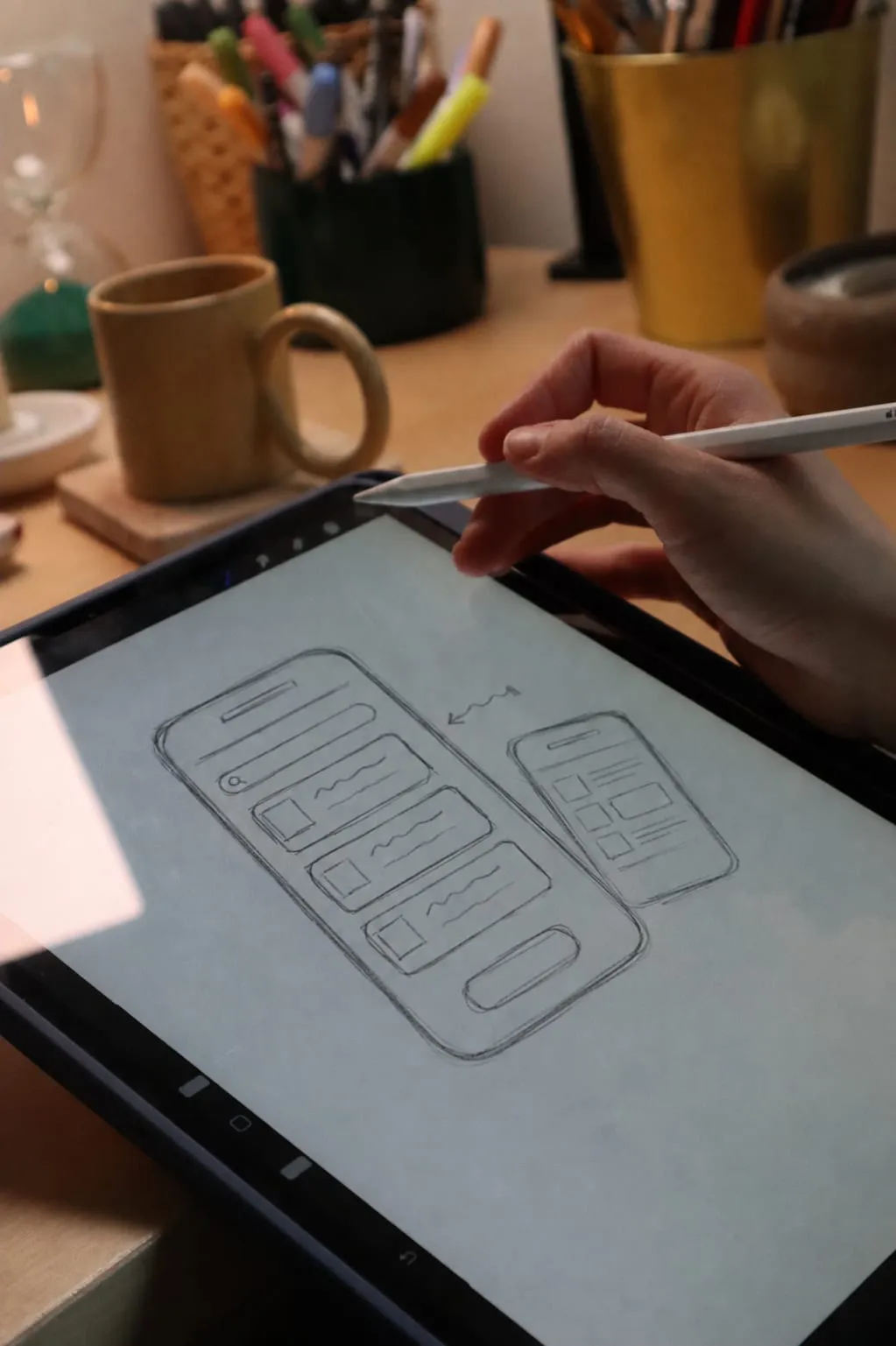 Screen sketches spread over a table